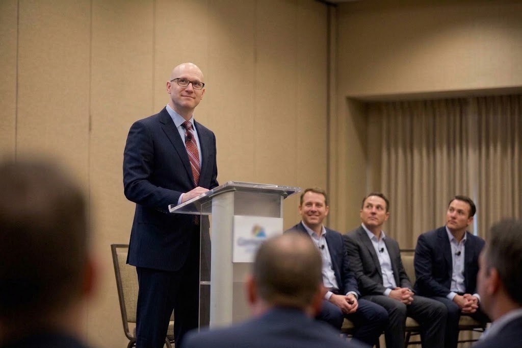 Paul Clark speaking on stage